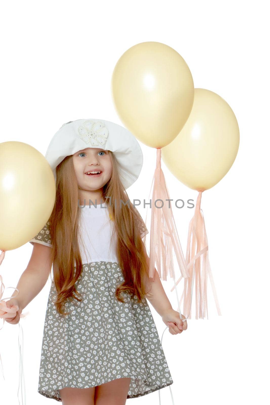 Little girl is playing with a balloon. The concept of a holiday, a birthday, a holiday in the fresh air. Isolated on white horse