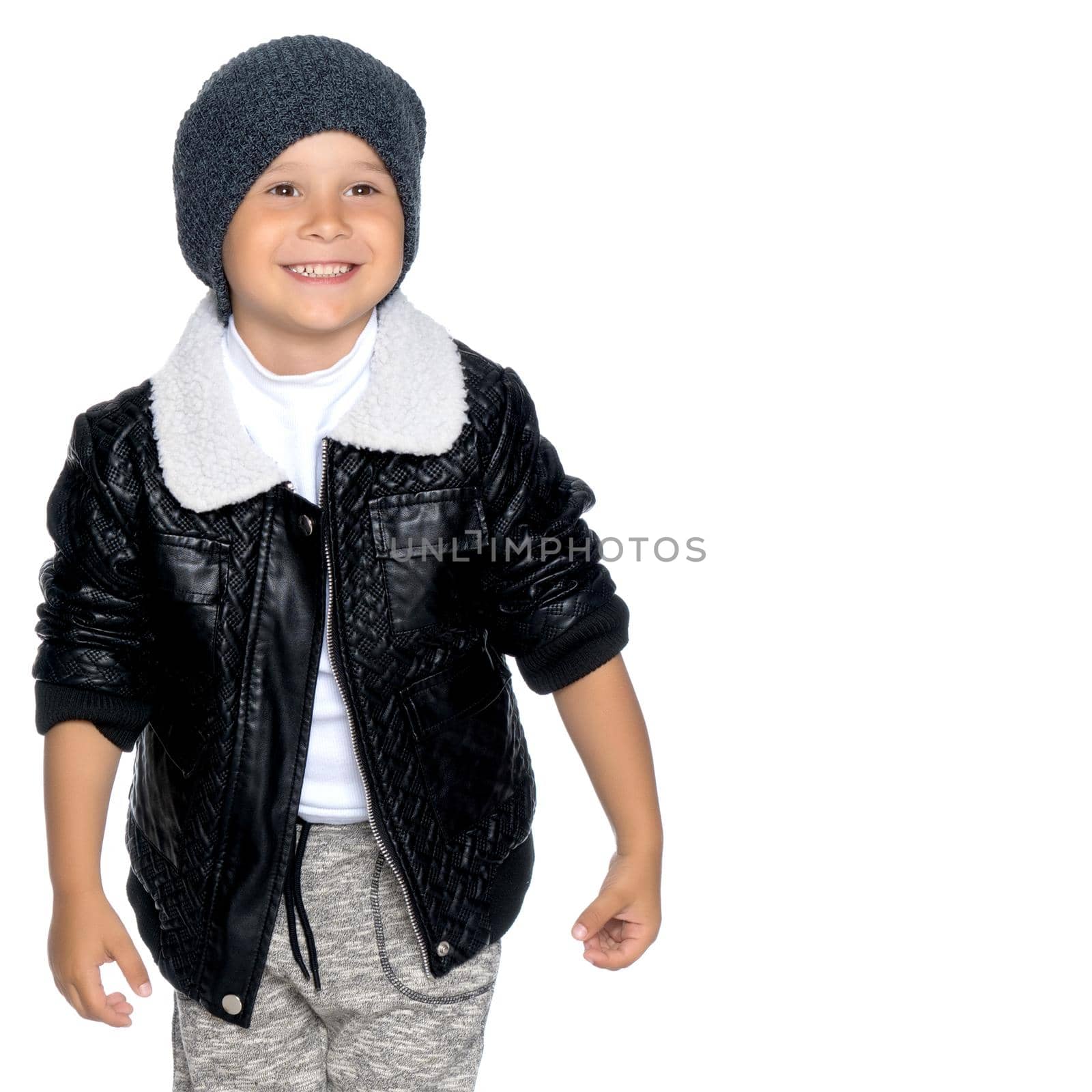 Portrait of a beautiful little boy close-up in the studio on a white background. Concept Happy childhood, family and people. Isolated.