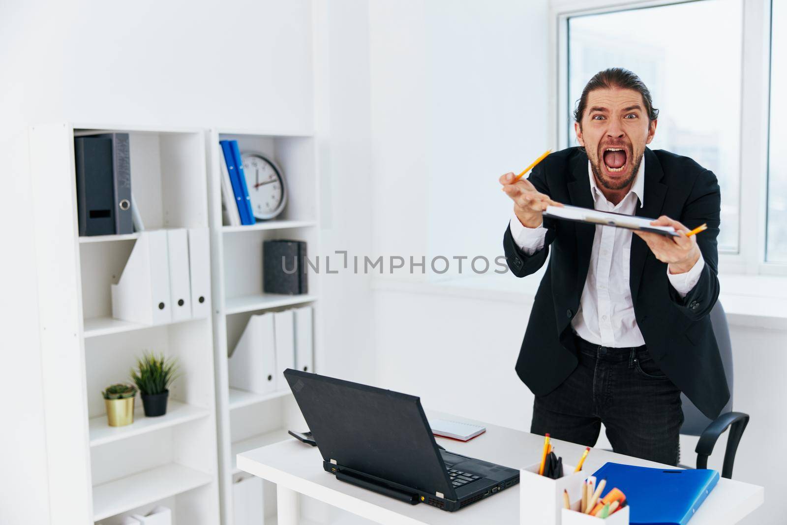 office worker workflow in the office documents emotions boss. High quality photo
