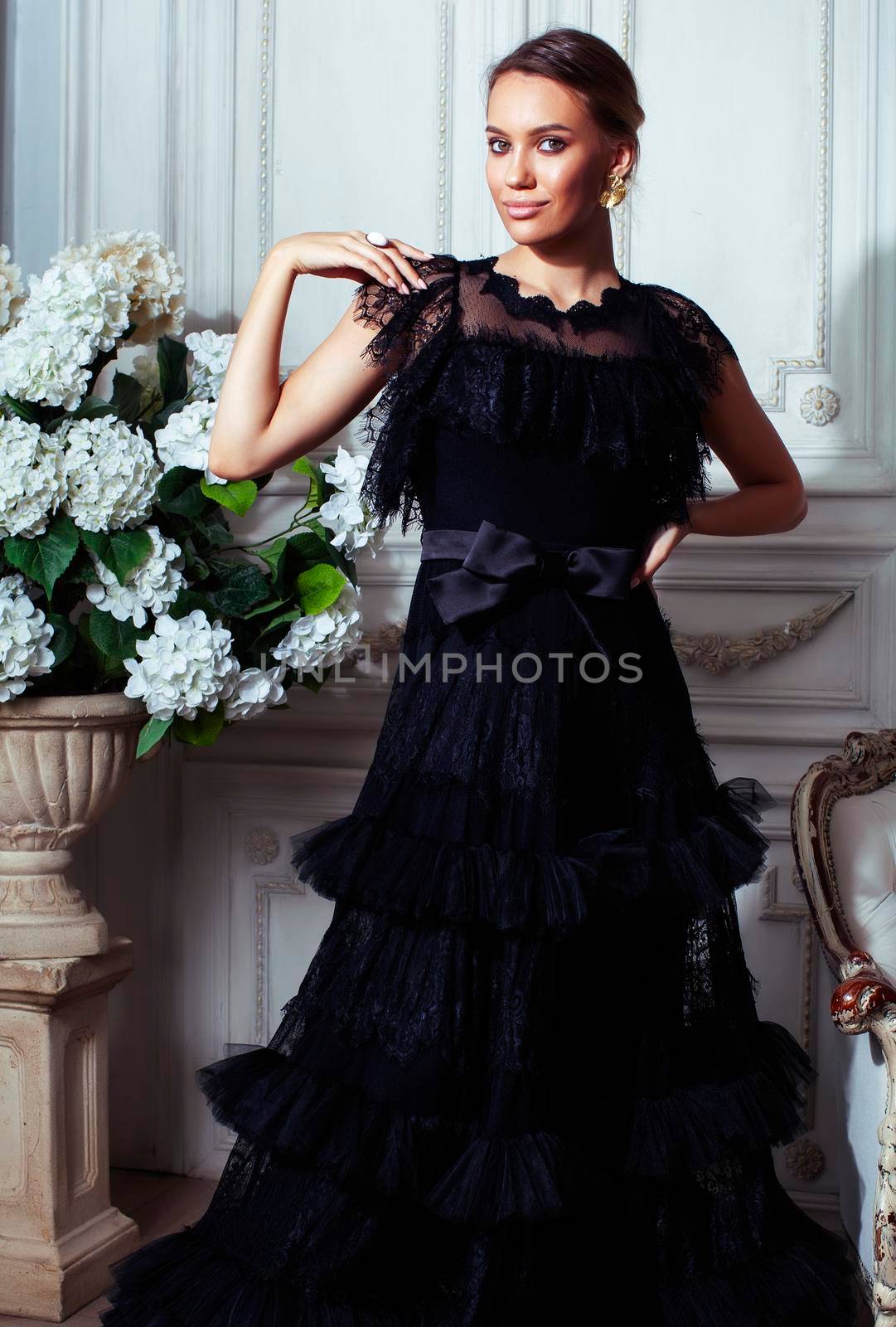 young pretty woman in black lace fashion style dress posing in rich interior of royal hotel room, luxury lifestyle people concept by JordanJ
