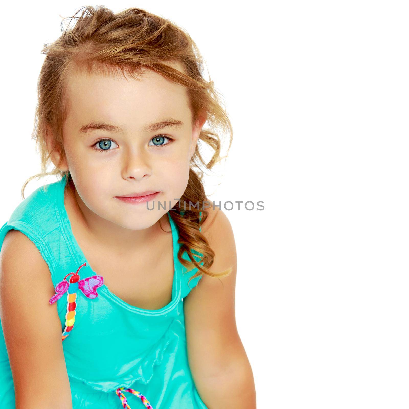 Beautiful little girl close-up. The concept of beauty and fashion, happy childhood. Isolated on white background.