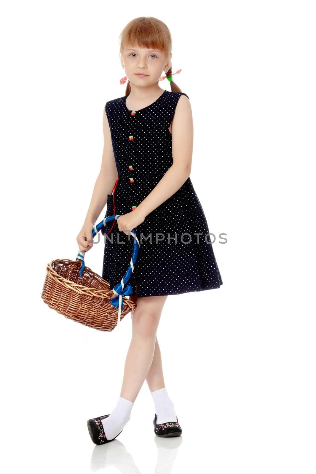 Little girl with a wicker basket by kolesnikov_studio