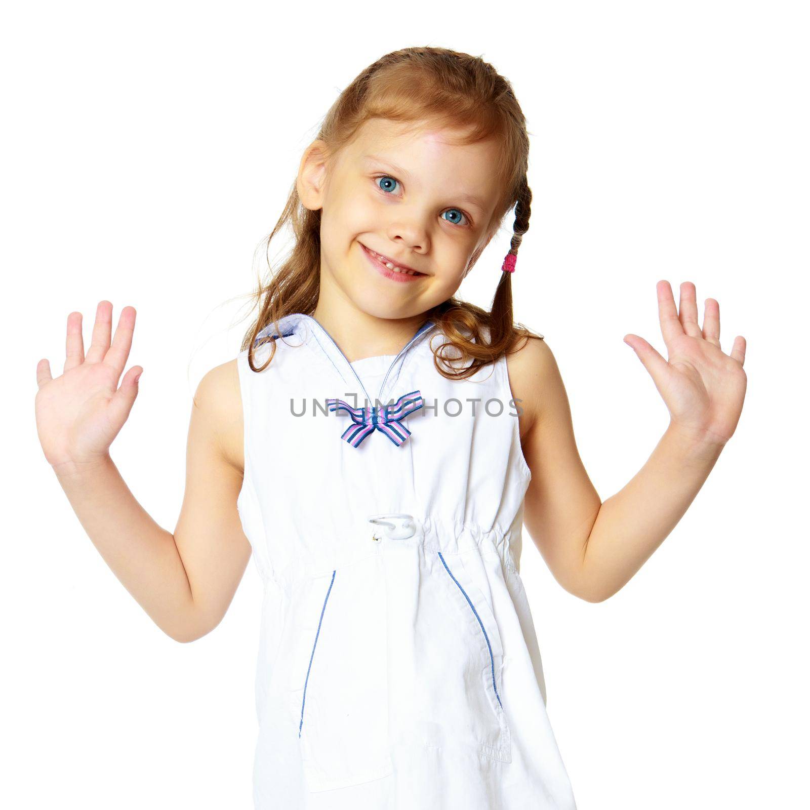 Studio portrait of a beautiful little girl. The concept of fashion, family happiness, harmonious development of the child. Isolated on white background.