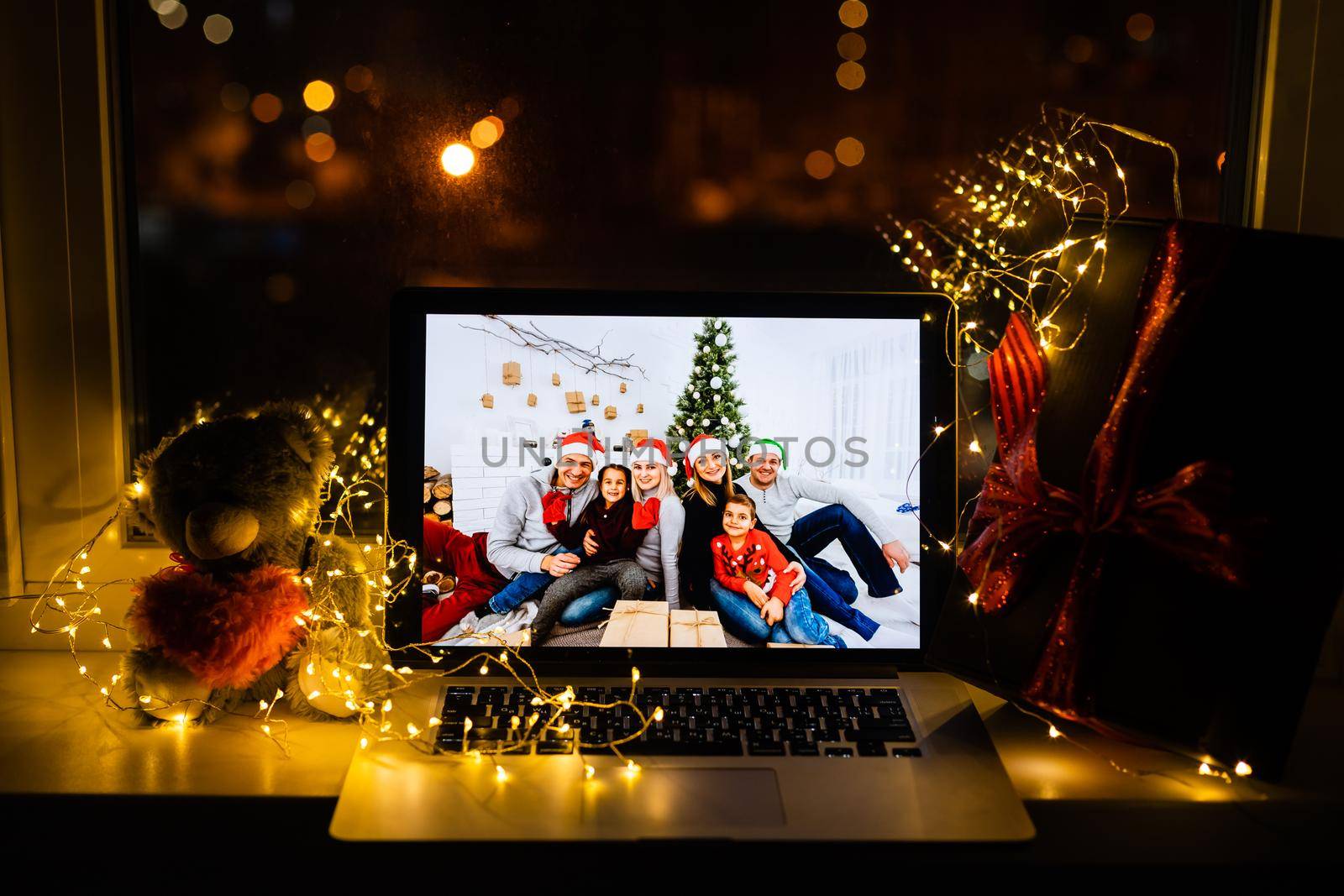 Portrait of attractive cheerful family chatting with friend on web congrats greetings festal eve tradition staying alone at home indoors by Andelov13