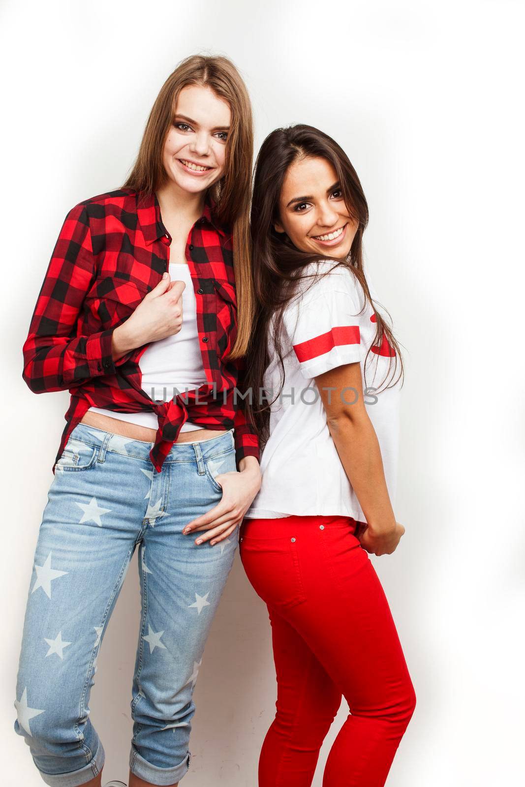 best friends teenage girls together having fun, posing emotional on white background, besties happy smiling, lifestyle people concept, blond and brunette multi nations by JordanJ