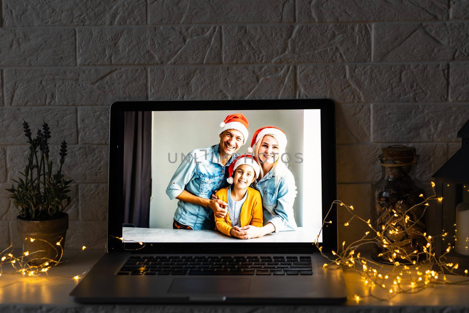 young family video call smiling and looking at webcam web, lovers greet friends merry christmas and happy new year by Andelov13