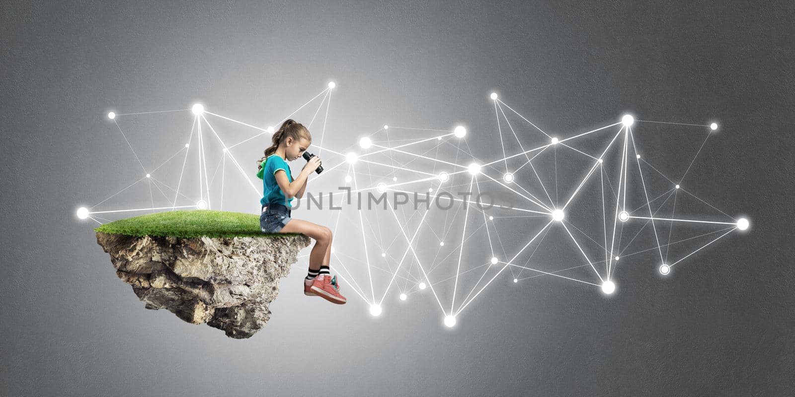 Concept of careless happy childhood with girl looking in binoculars by adam121