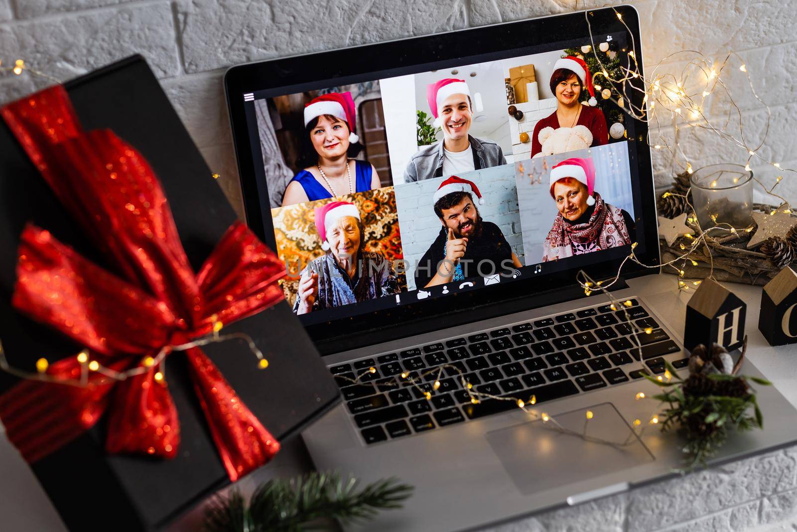 video call celebrating christmas by laptop online during coronavirus outbreak by Andelov13