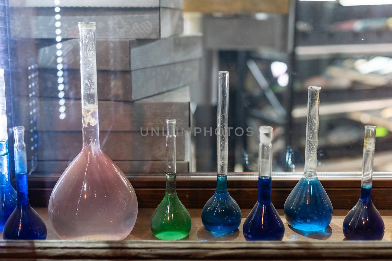 Chemistry laboratory. Conducting a chemical experiment. Experiments in the laboratory. Flasks and test tubes with colored liquid. The child conducts an experiment in a chemical laboratory. The science.