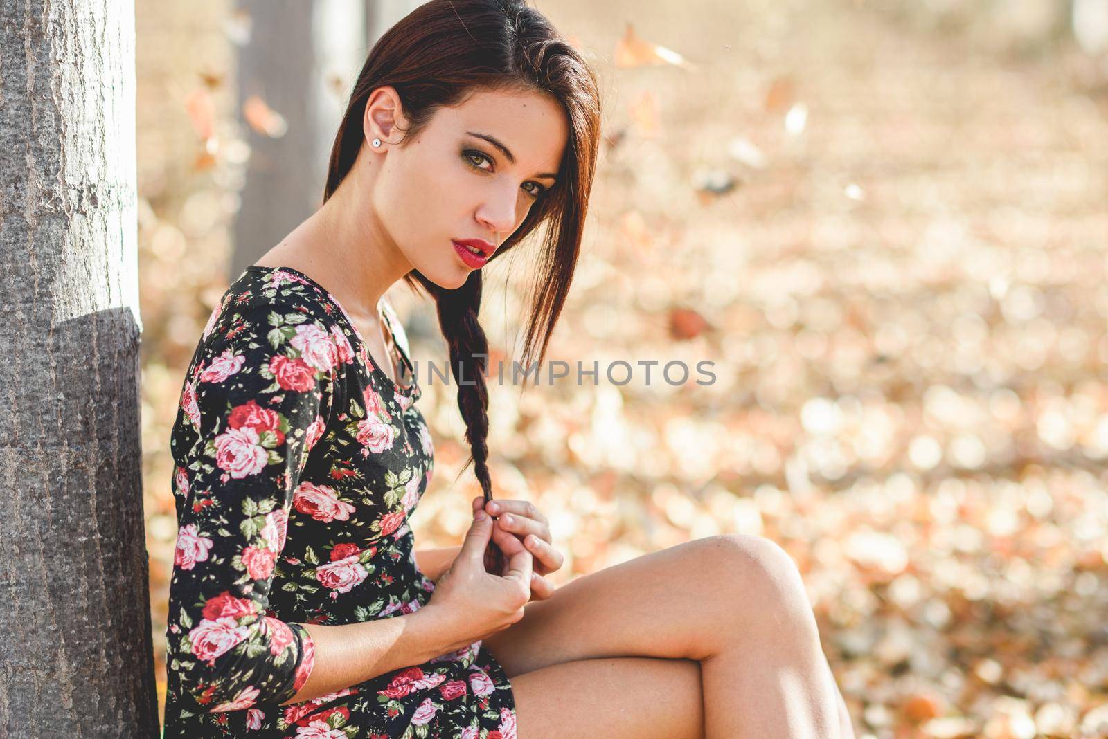 Portrait of pretty girl with green eyes wearing casual clothes in an autumn field
