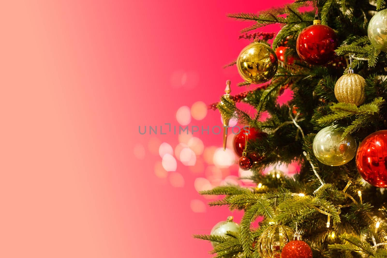 Decorated Christmas tree closeup, balls, garland.