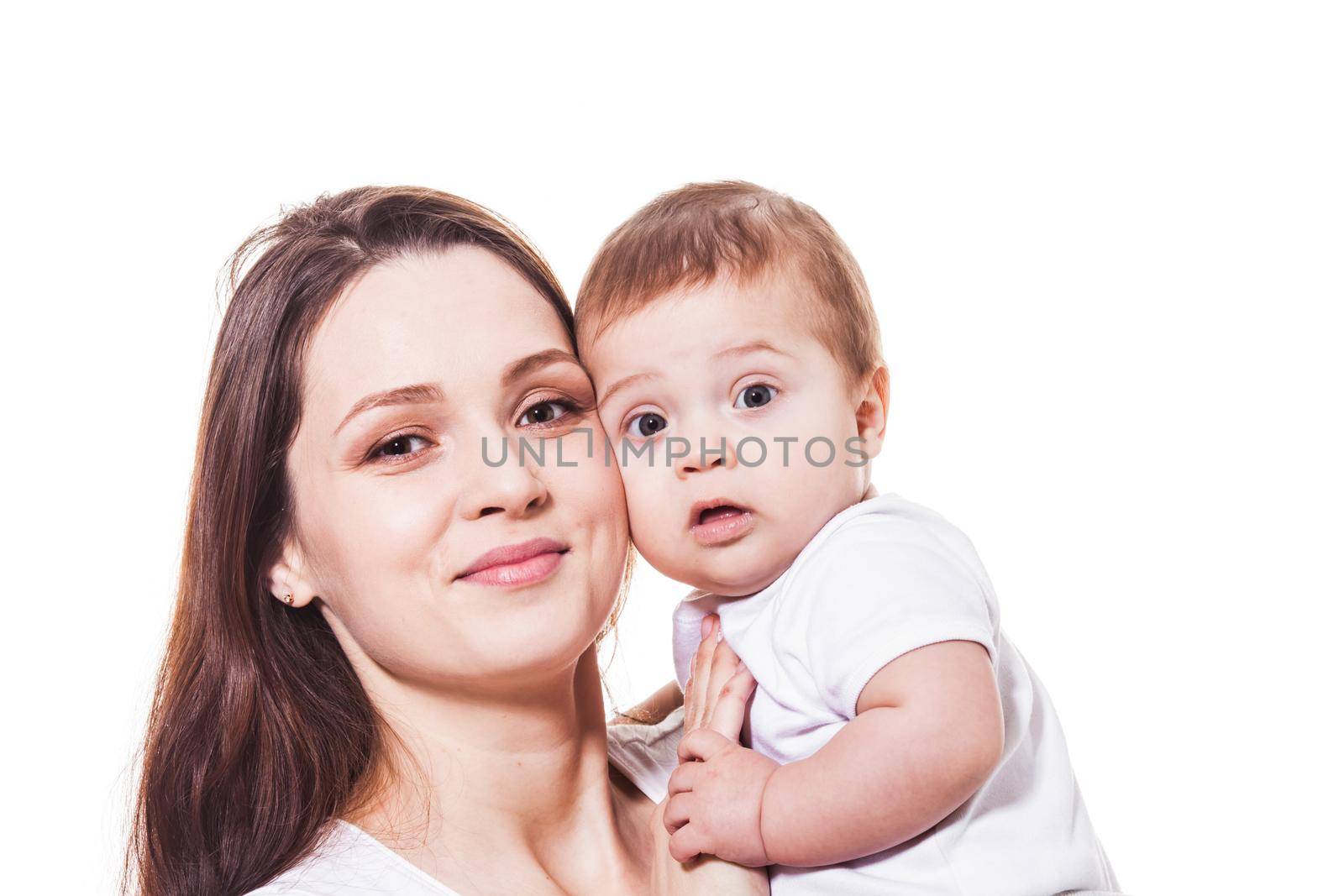 Adorable young mother and child looking at the camera. Portrait on the white backgrund