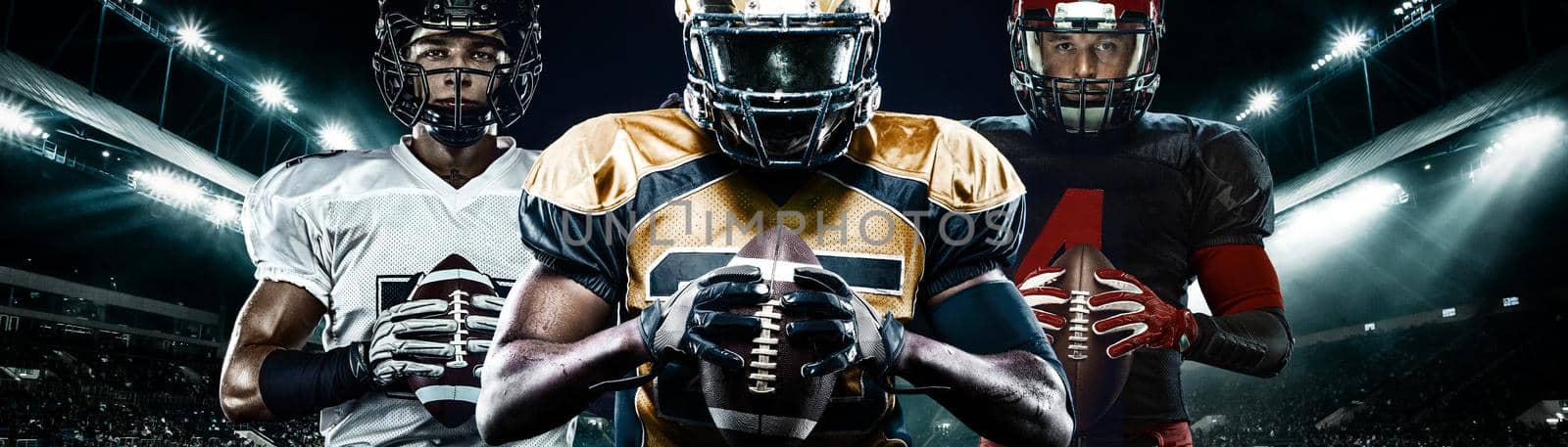 American football player, athlete sportsman in red helmet on stadium background. Sport and motivation wallpaper. Wide photo. by MikeOrlov