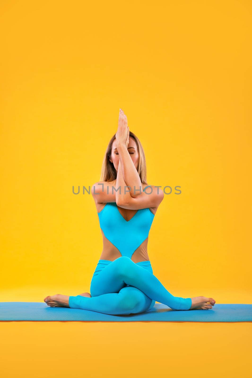 Yoga Indoor. Sports recreation. Beautiful young woman in asana pose. Individual sports. by MikeOrlov