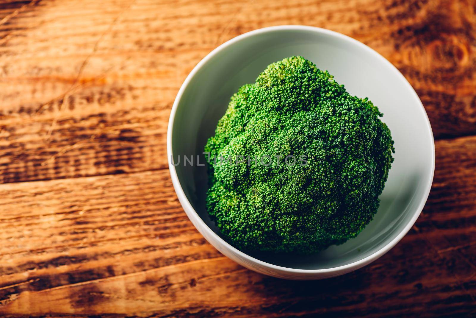 Head of broccoli in bowl ready to be prepared for a recipe