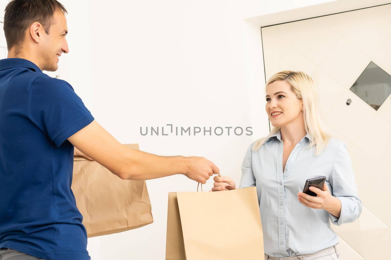 Delivery man holding cardboard boxes. Fast and free Delivery transport . Online shopping and Express delivery . Quarantine