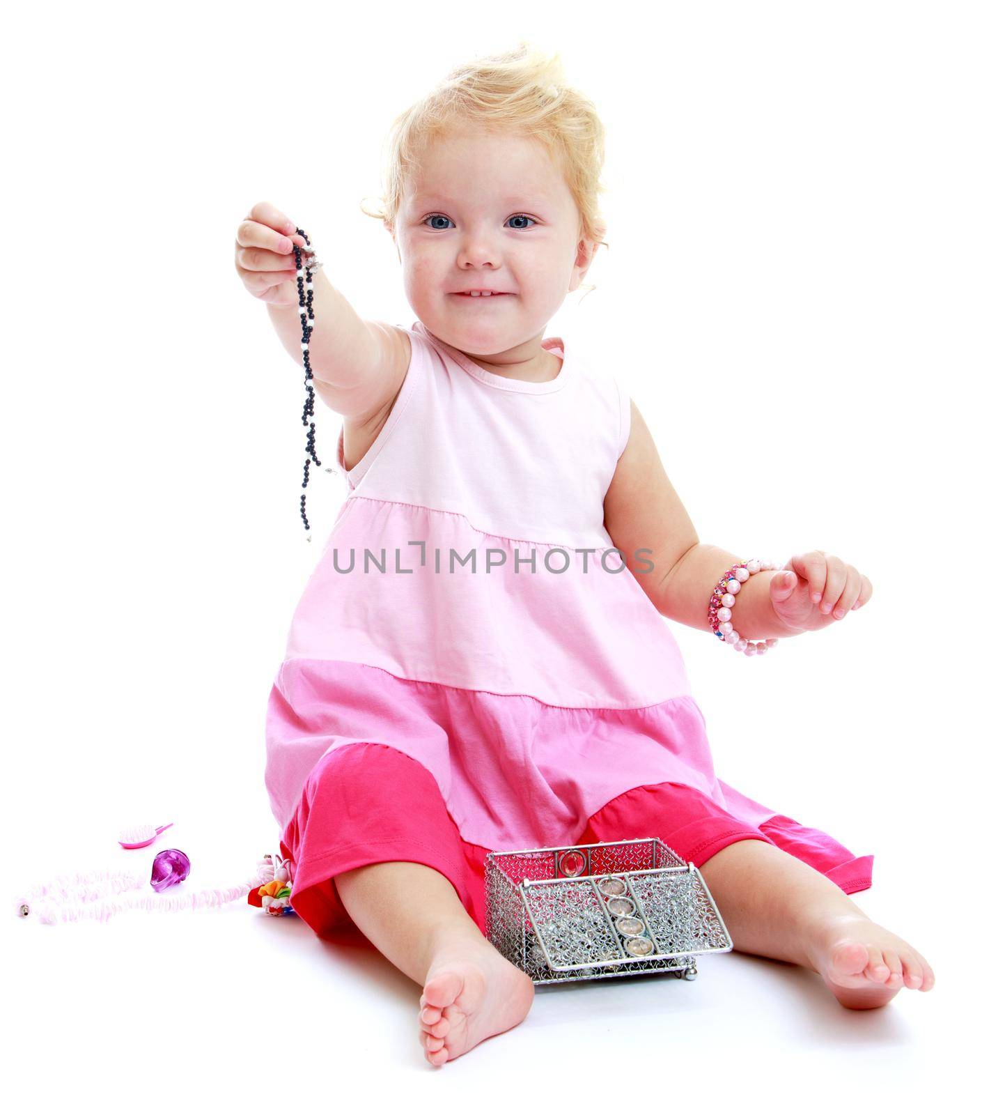 Charming girl with jewellery, isolated white background