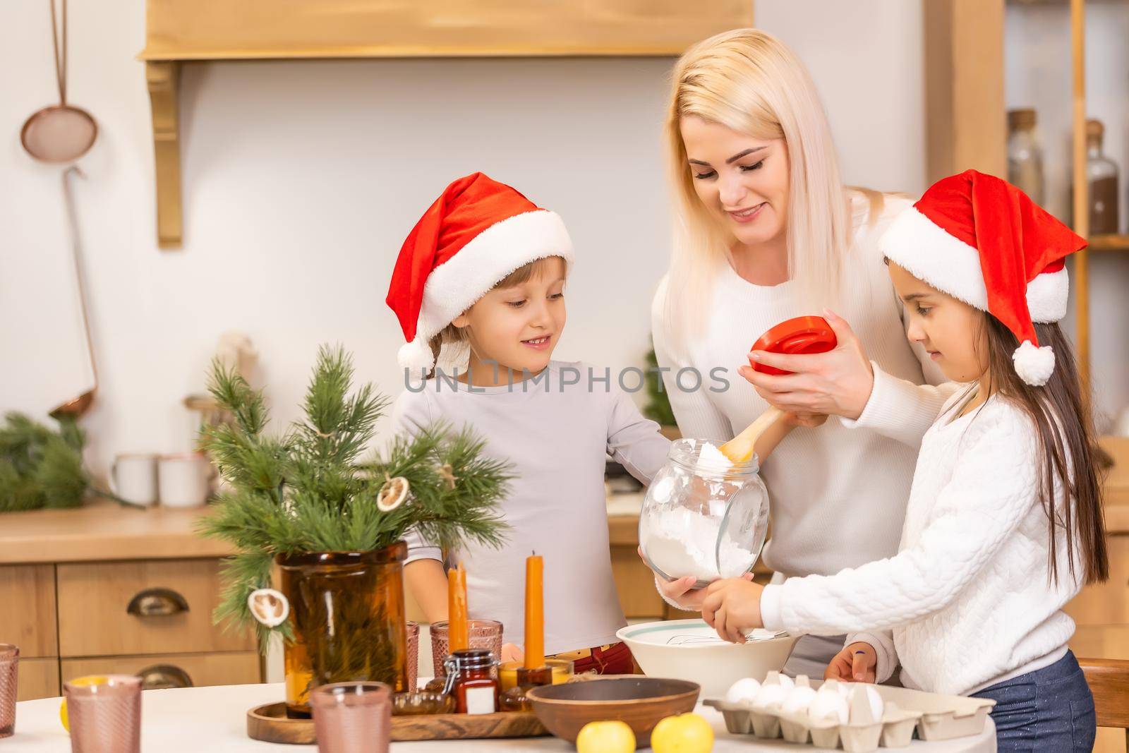 Happy family having fun at home, family cooking before christmas by Andelov13