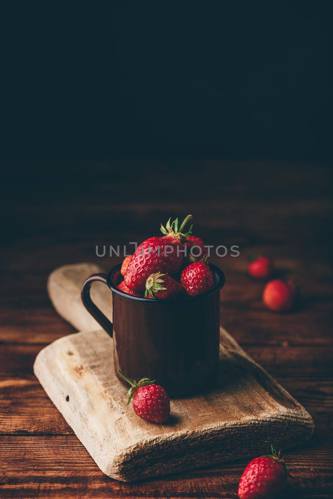 Fresh red strawberries in mug