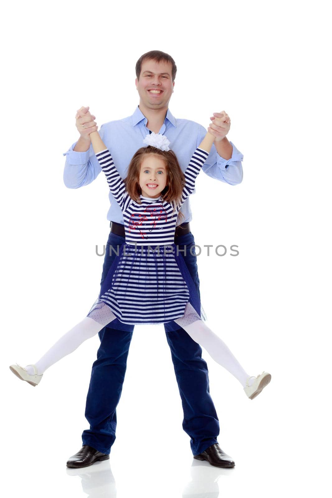 Happy young dad raise his beloved daughter's hands.Isolated on white background.