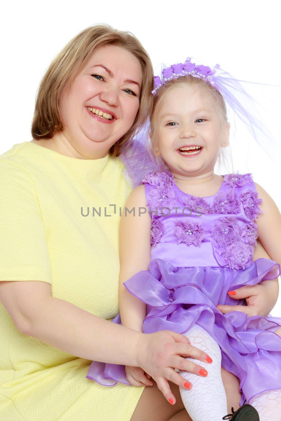 Mom and little daughter plus the size of the model, gently embrace. A woman and her daughter are smiling in a happy manner. Good for the concept of health, happiness, diet, obesity, weight loss.