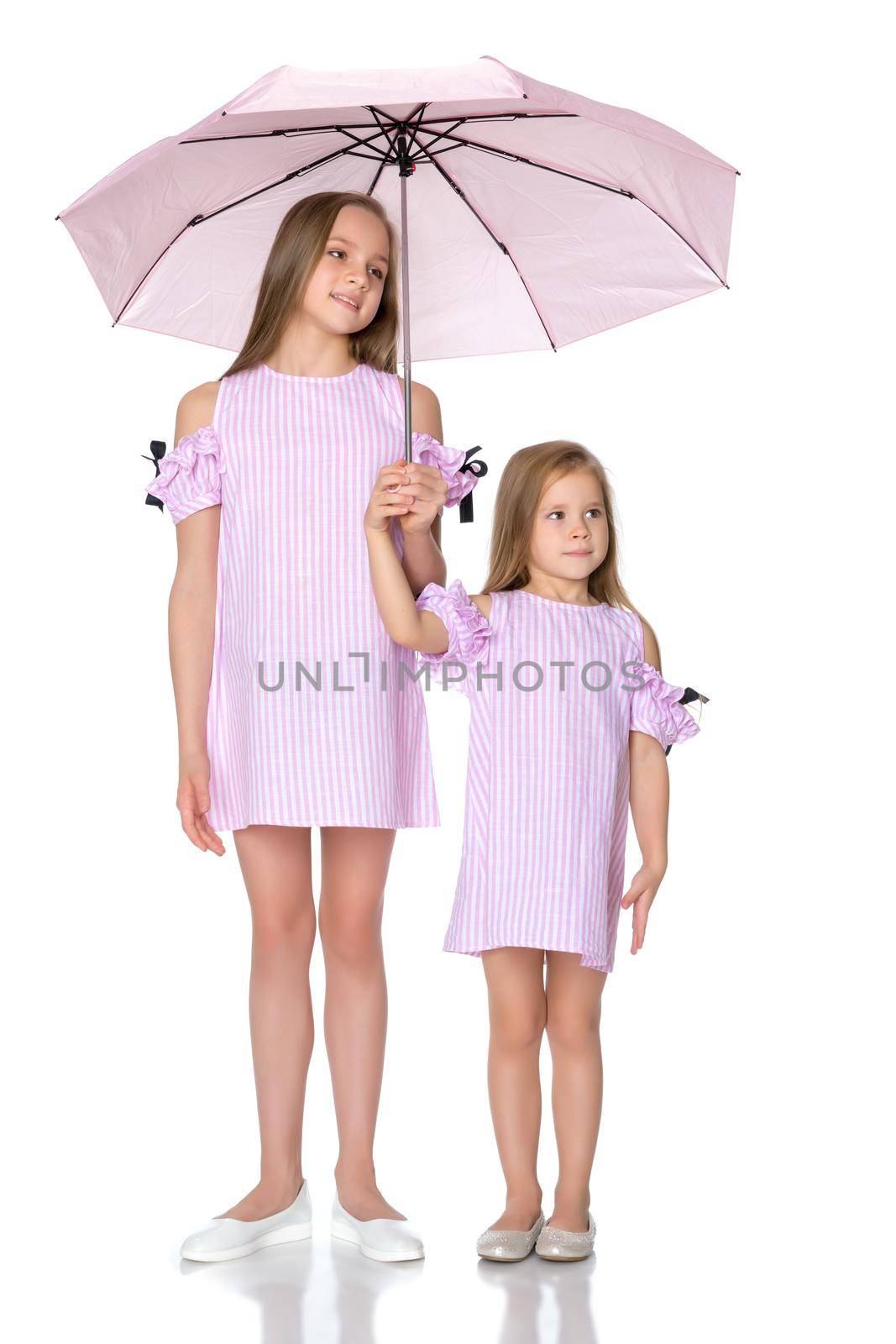 Two girls are standing under umbrellas. by kolesnikov_studio