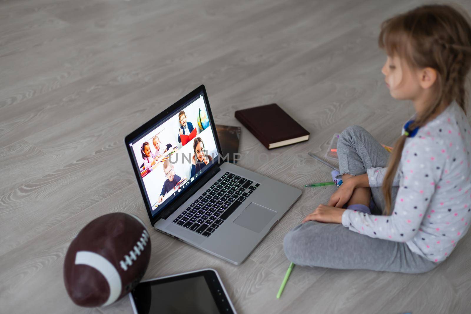 Little girl using video chat on laptop at home. Space for text