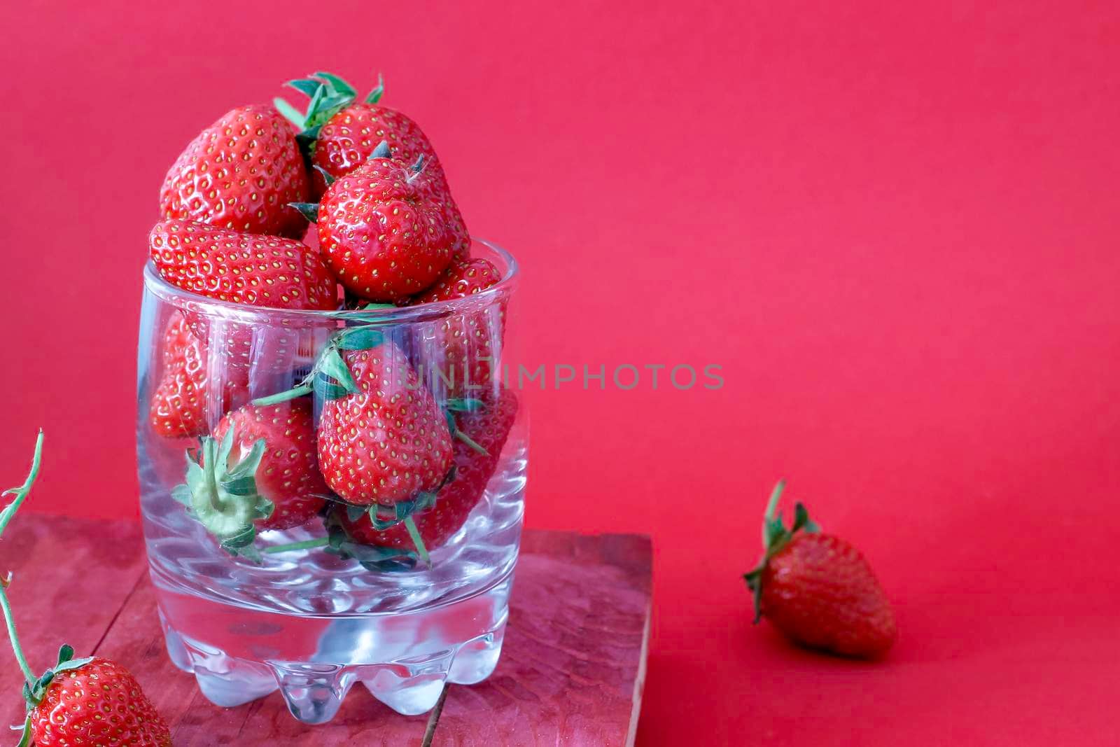 summer strawberries in a glass by mariya_tsapenko
