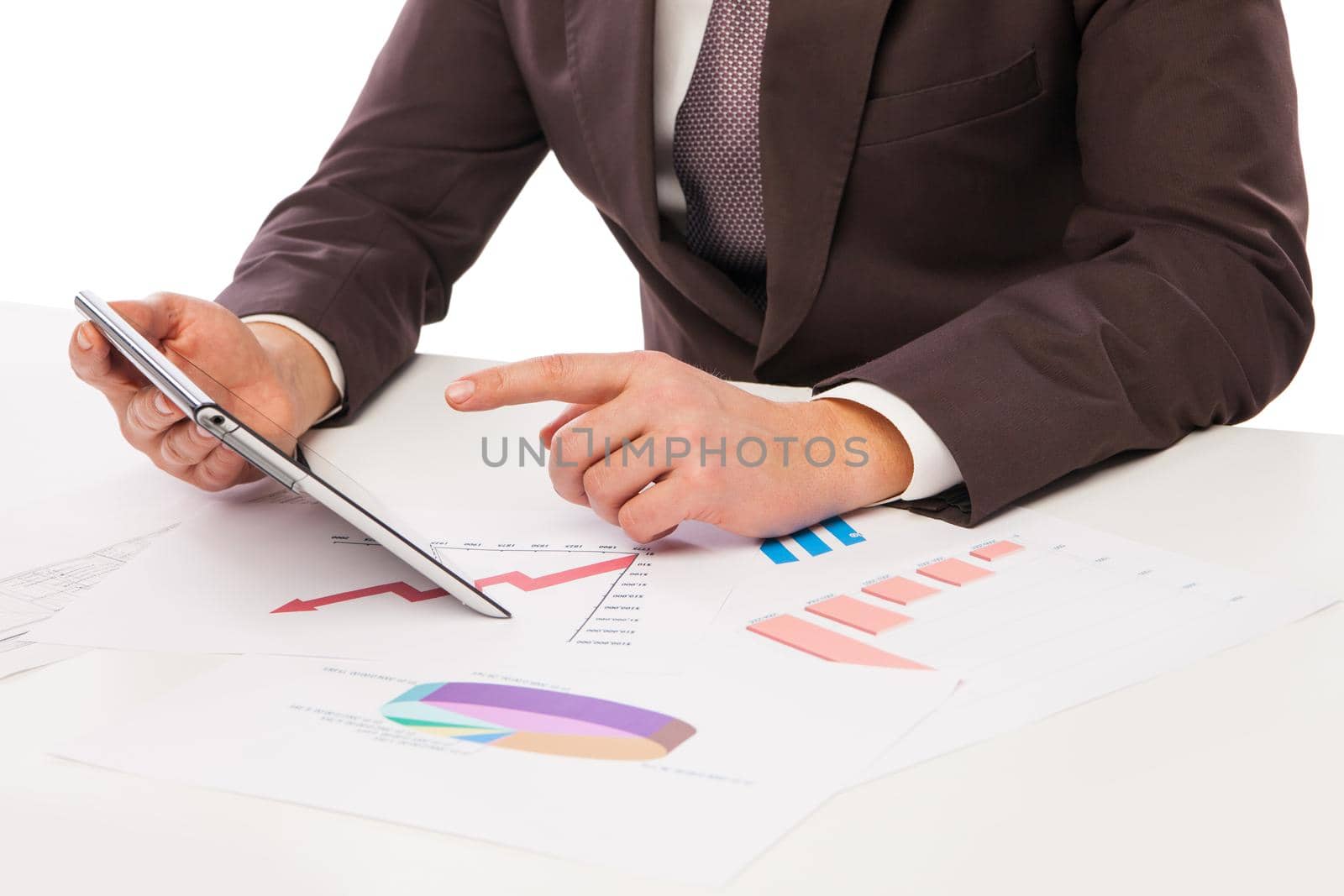 Businessman using tablet PC in office isolated over white. Draft on table