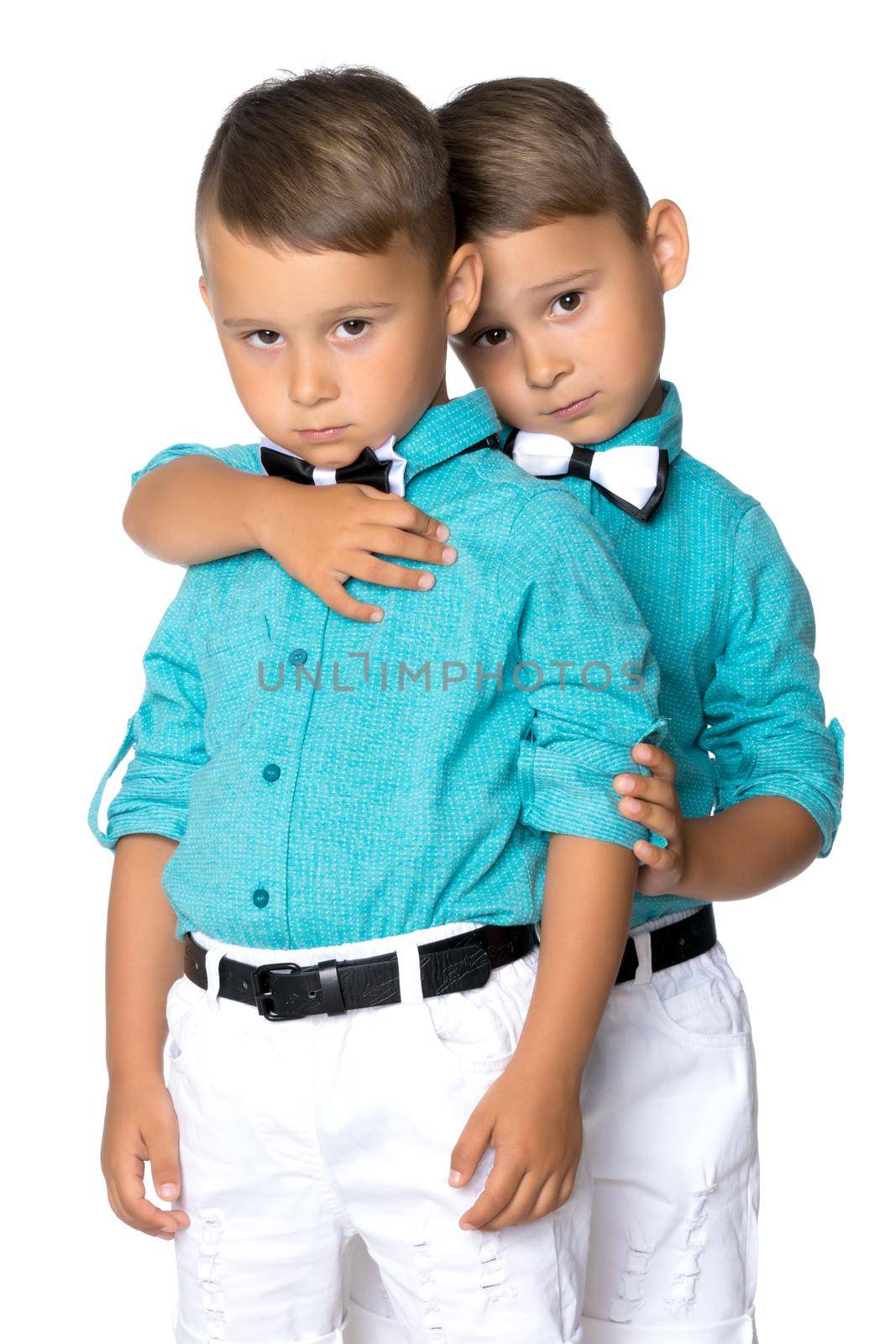 Two little brothers of Gemini together are sad. Isolated on white background