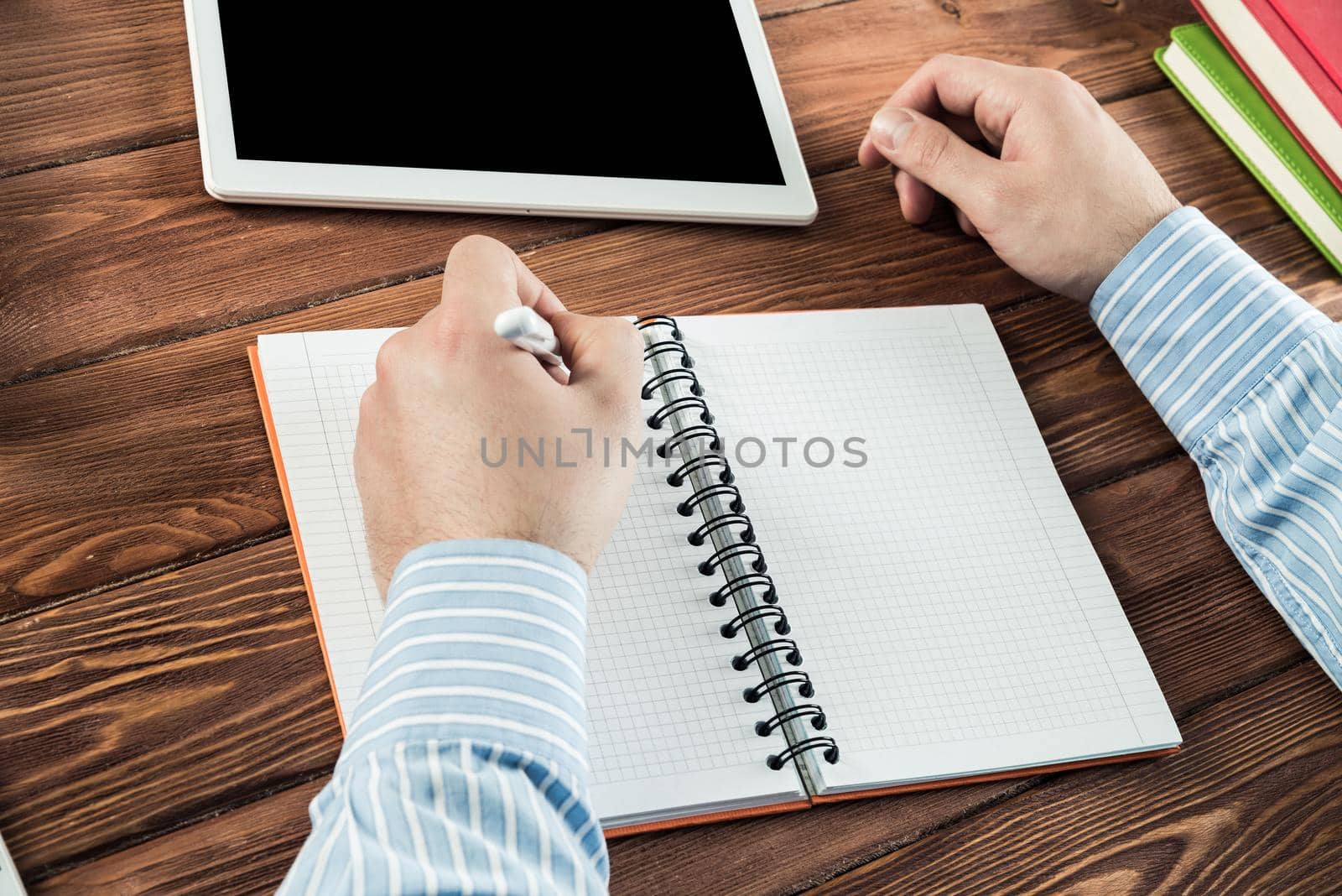 close-up of hands with notepad. office work