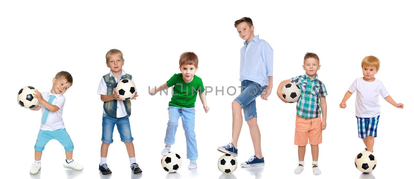 A large group of children and teenagers playing with a soccer ball. The concept of children's sport, a healthy lifestyle. Isolated on white background.