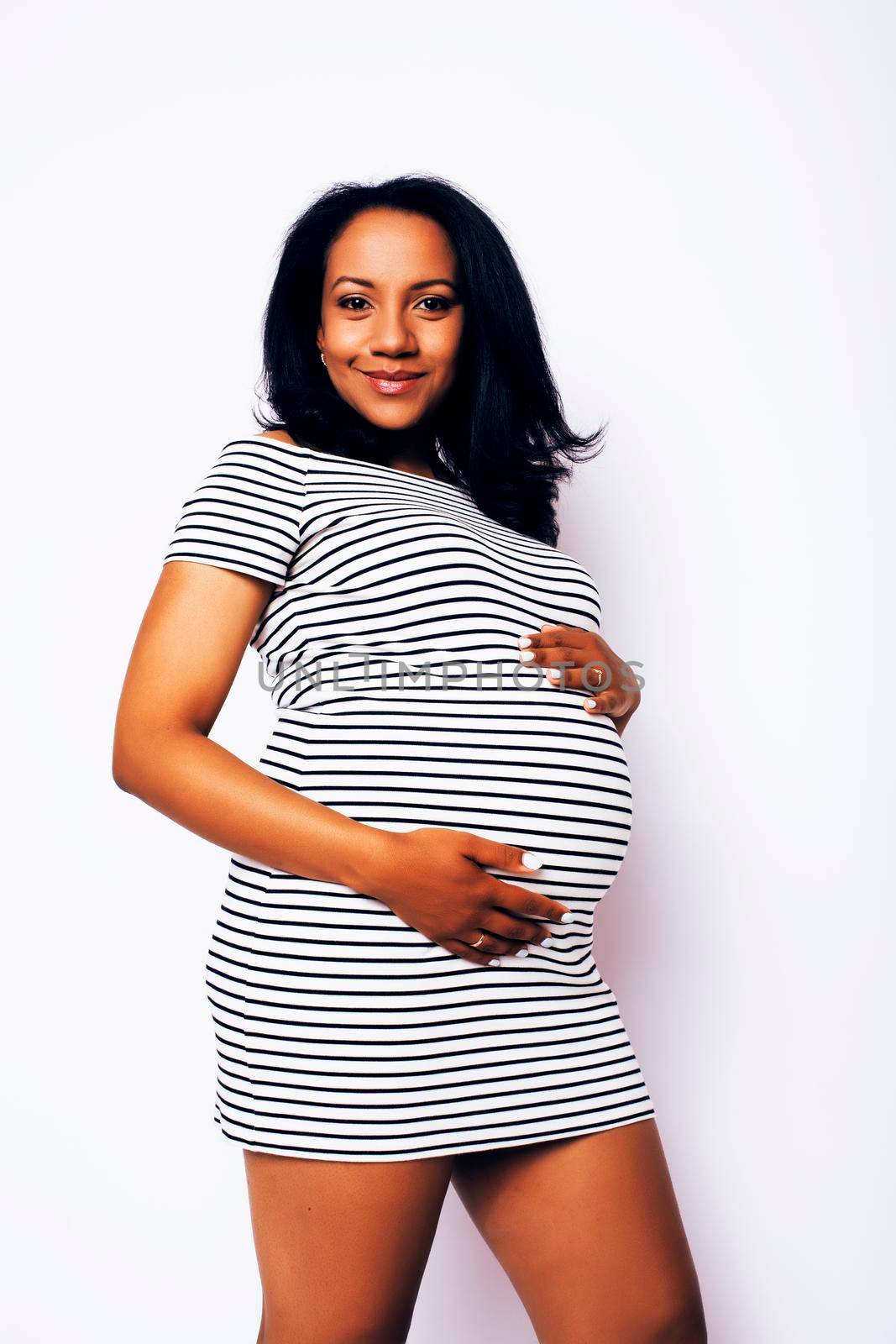 young pretty african american woman pregnant happy smiling, posing on white background isolated , lifestyle people concept copyspace close up