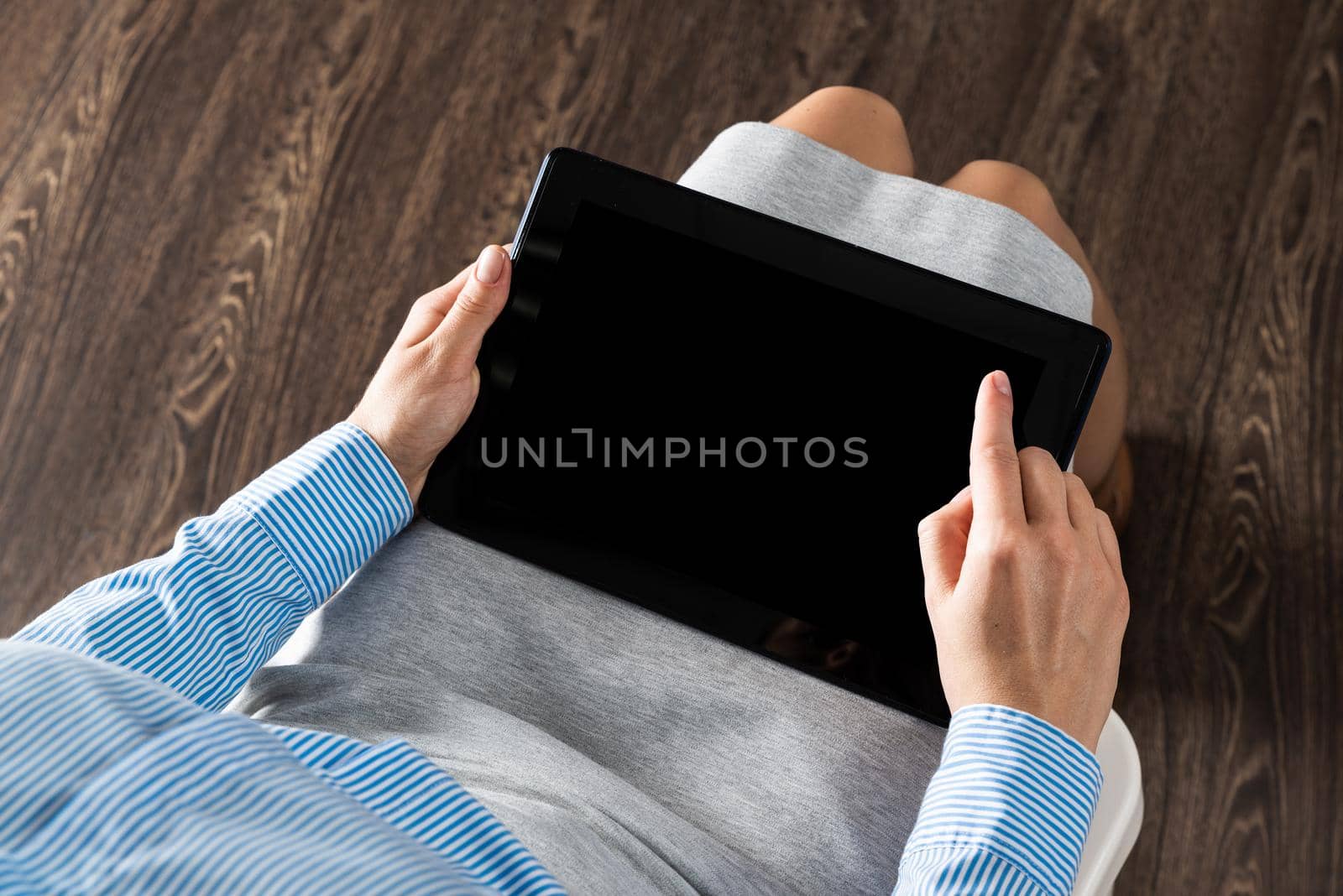 close-up of female hands with a computer tablet