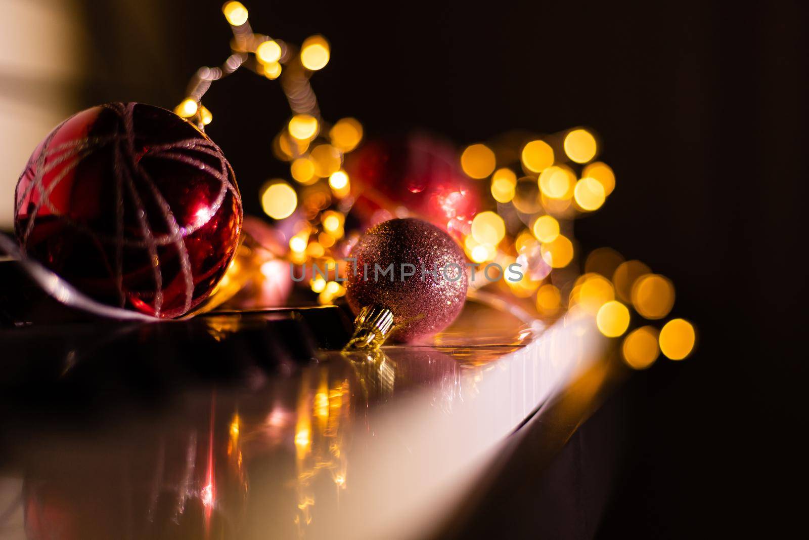 Piano keys with Christmas decorations, closeup happy new year by Andelov13