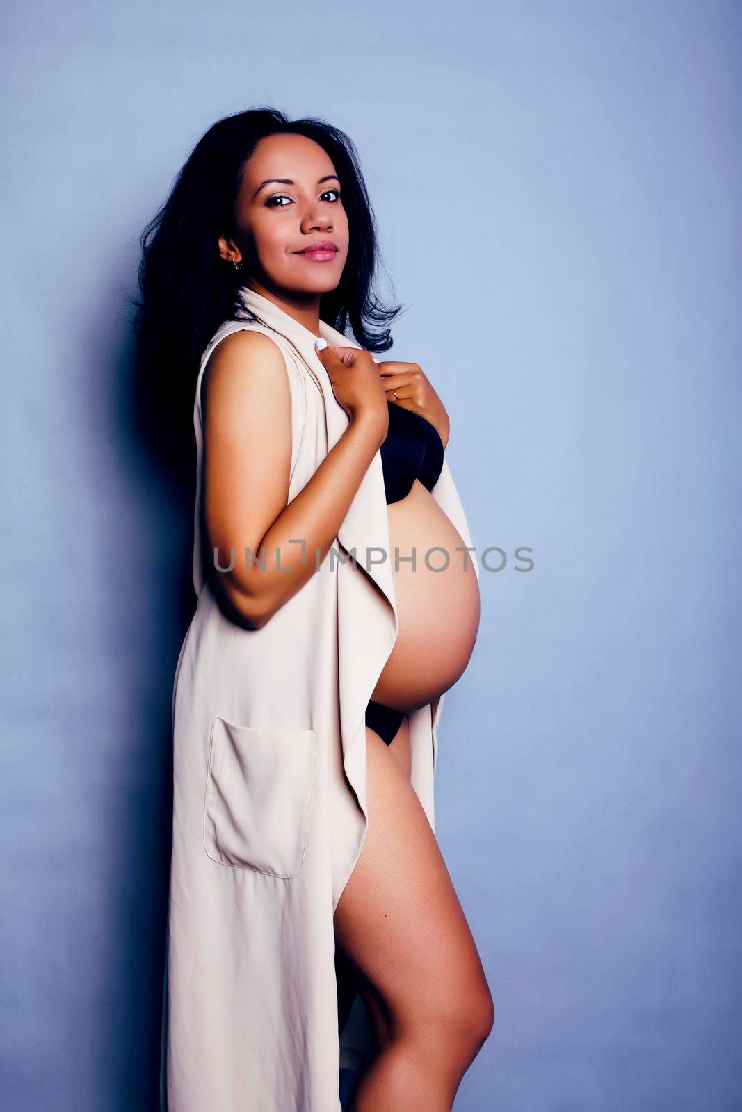 young pretty african american woman pregnant happy smiling, posi by JordanJ