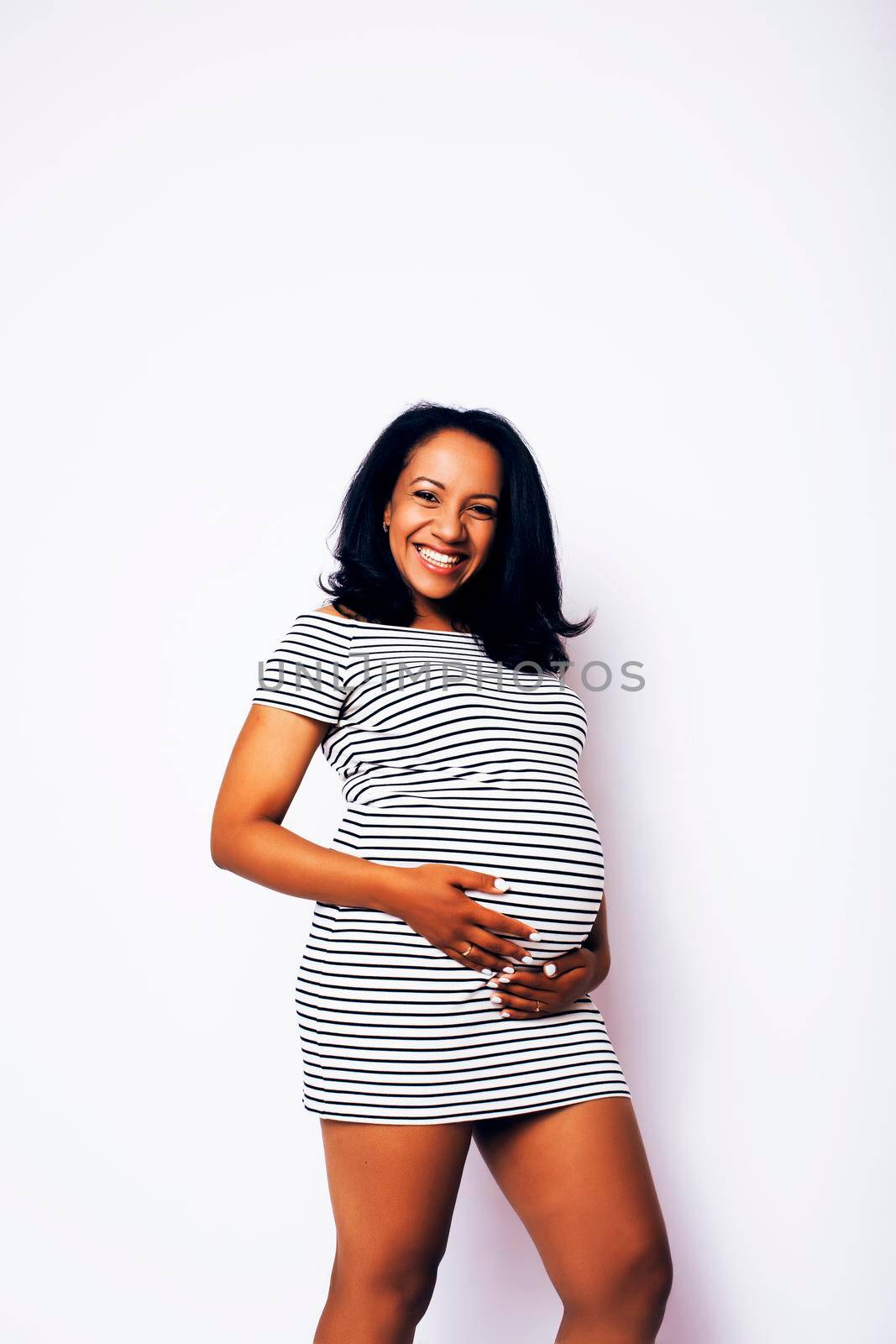 young pretty african american woman pregnant happy smiling, posing on white background isolated , lifestyle people concept copyspace by JordanJ