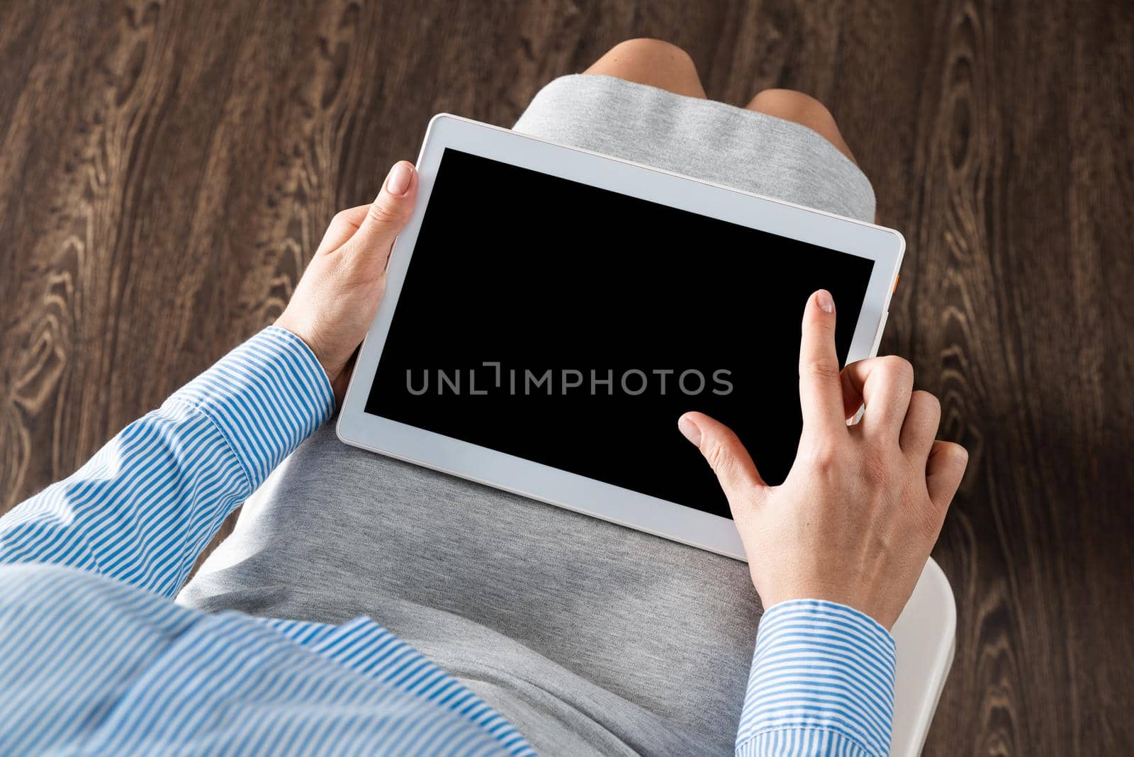 close-up of female hands with a computer tablet