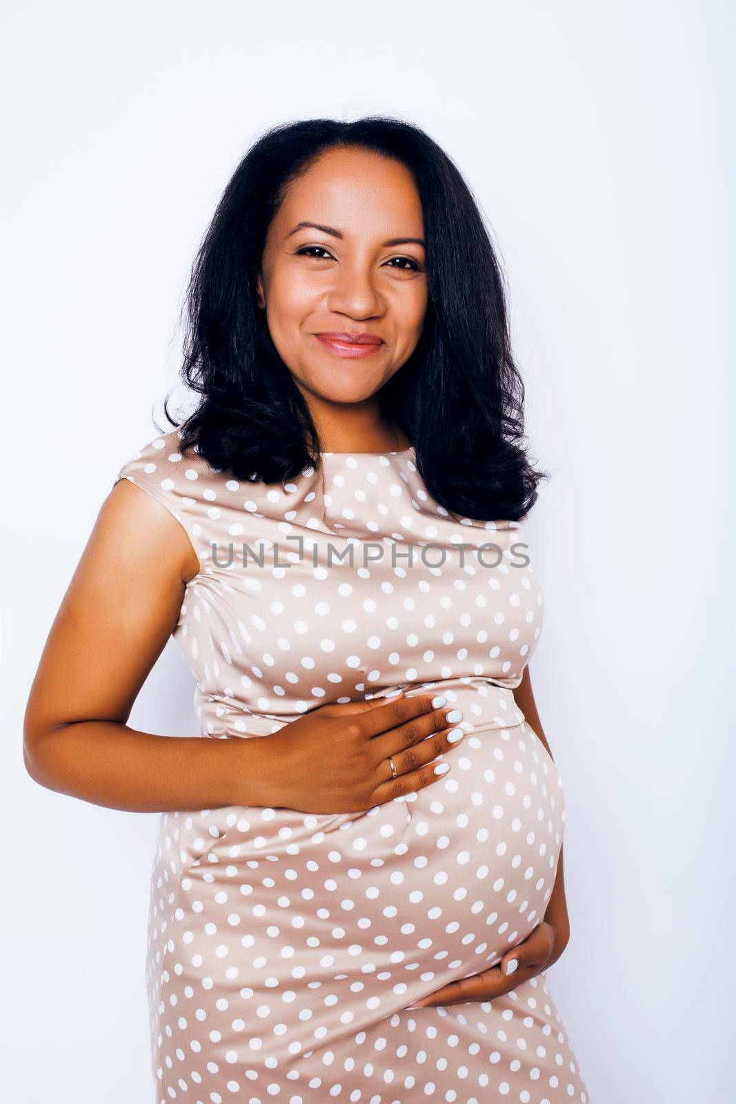 young pretty african american woman pregnant happy smiling, posing on white background isolated , lifestyle people concept copyspace