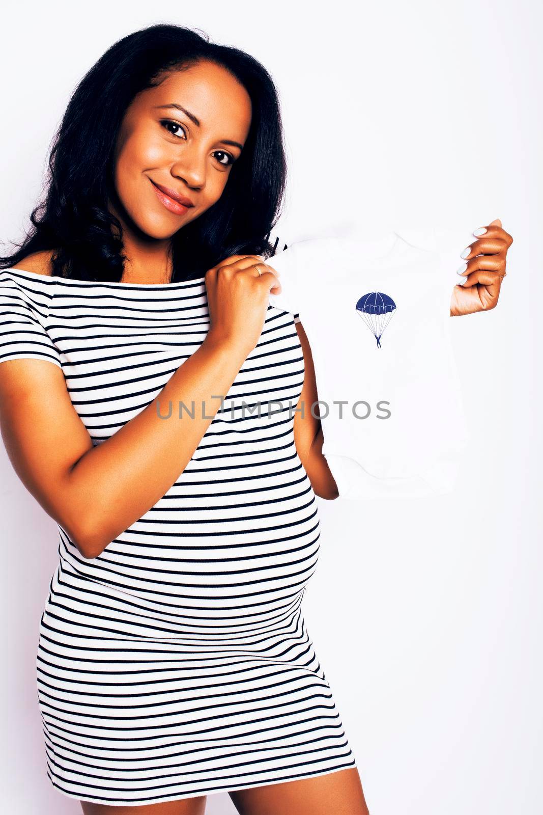 young pretty african american woman pregnant happy smiling, posing on white background isolated , lifestyle people concept copyspace close up