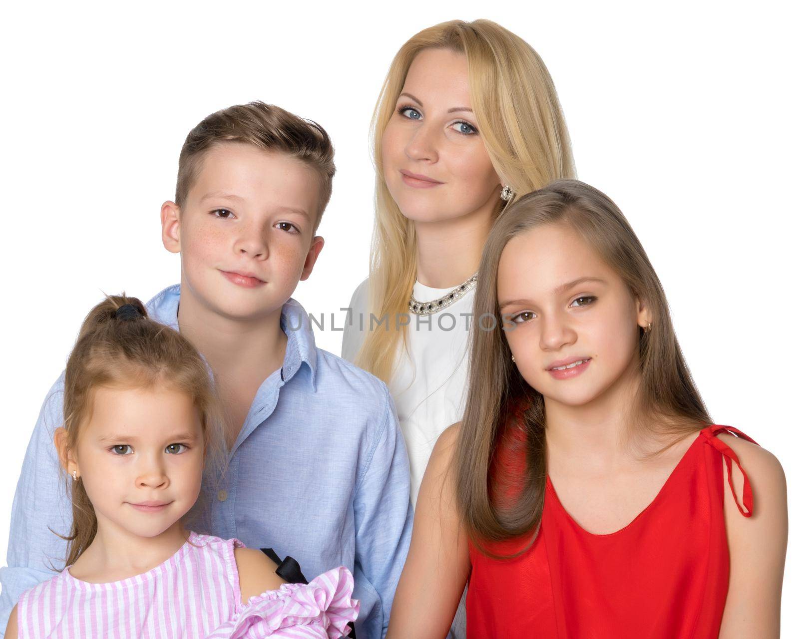 Happy young mother with children in the studio on a white background. The concept of family values, the upbringing of children. Isolated.