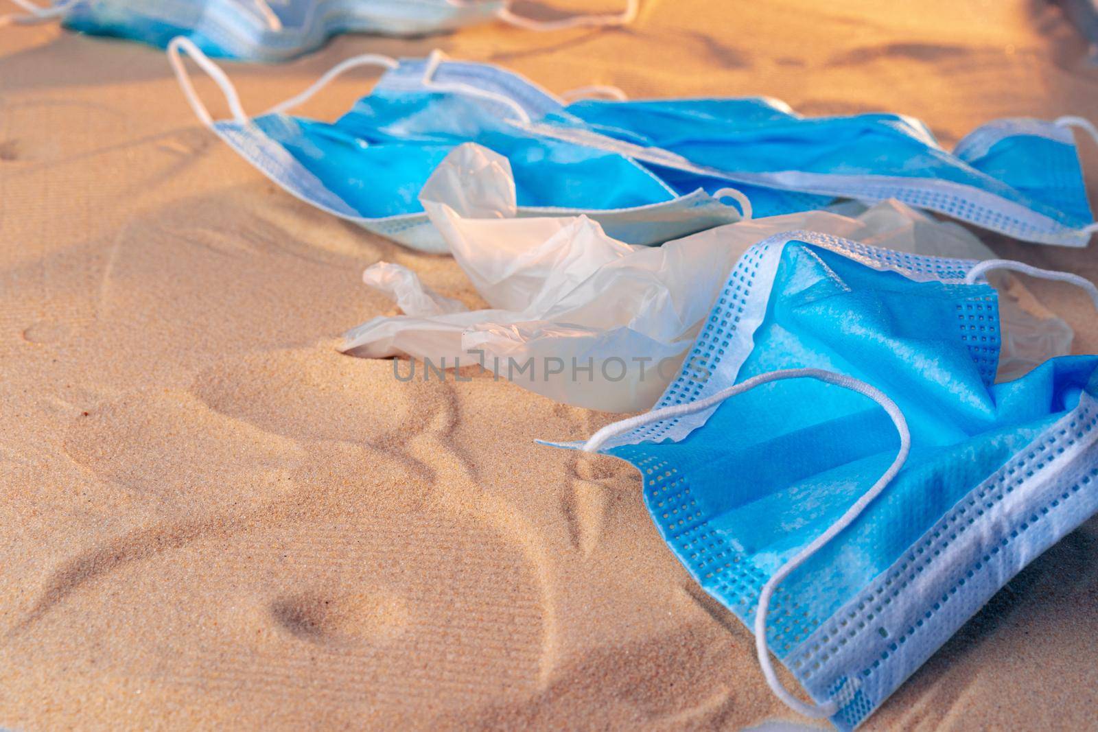 Protective facial mask on the natural outdoors beach background by Fabrikasimf