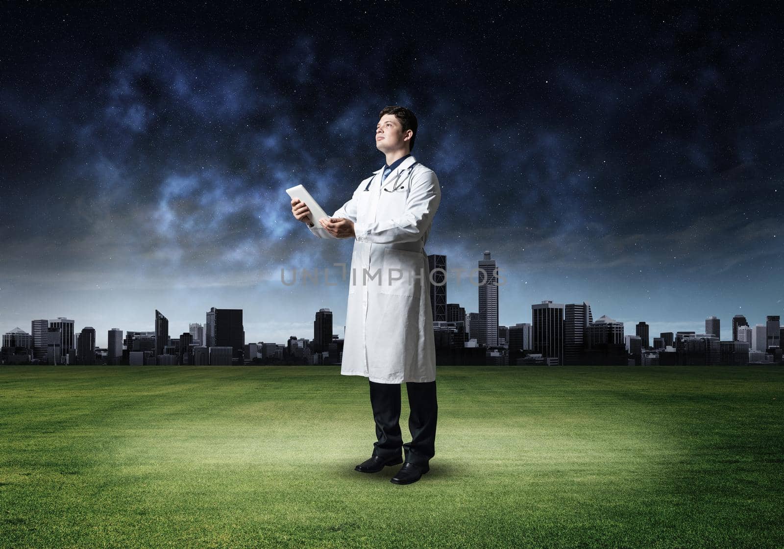 portrait of a doctor, holding a tablet