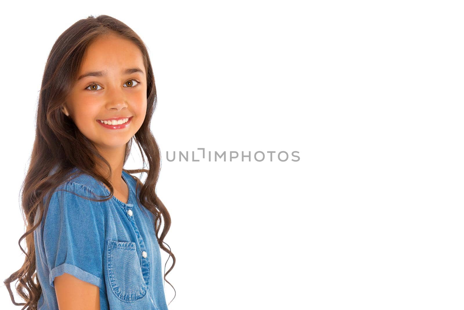 Portrait of a beautiful asian teenage girl with long black hair, in denim overalls. The concept of advertising a healthy lifestyle, beauty and fashion. Isolated on white background.