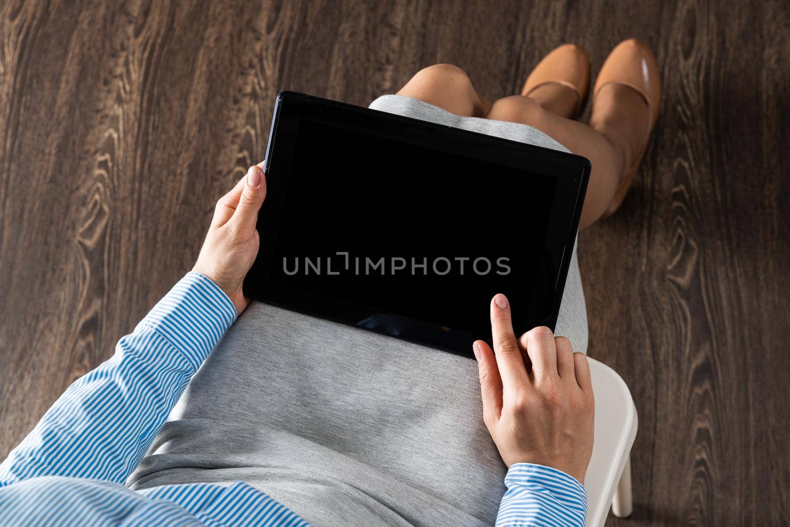 close-up of female hands with a computer tablet