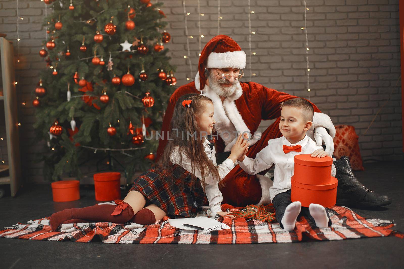 Children at home, decorated for Christmas. Santa's mail.