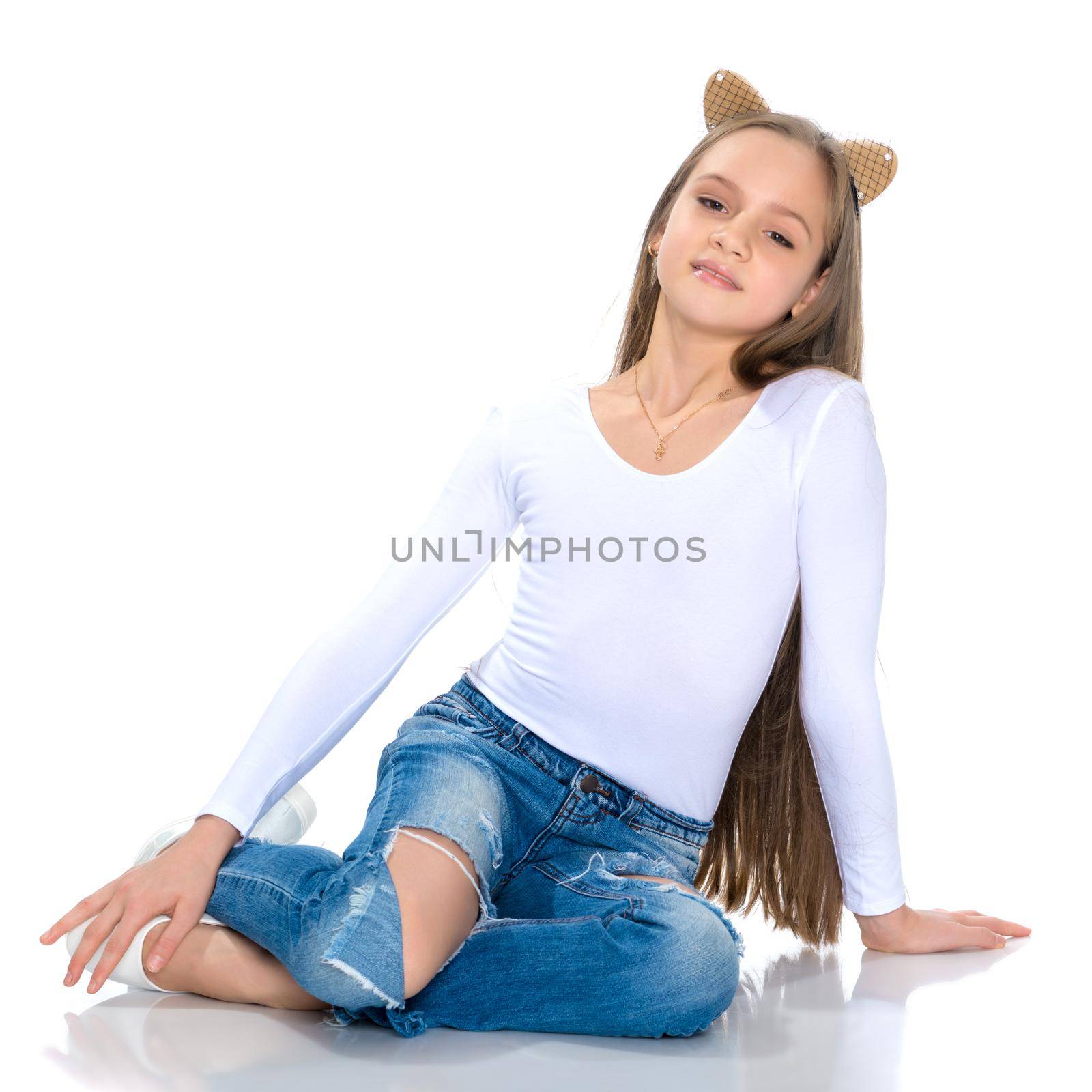 Beautiful teen girl in jeans with holes. by kolesnikov_studio