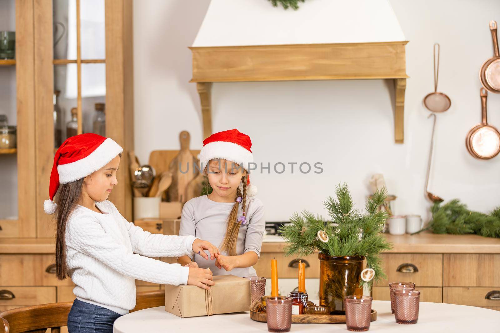 Two little girls with a christmas present