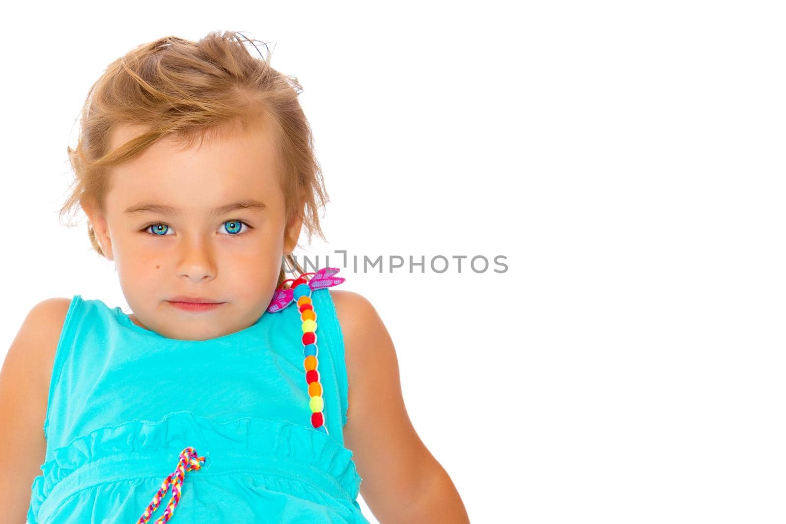 Beautiful little girl close-up. The concept of beauty and fashion, happy childhood. Isolated on white background.