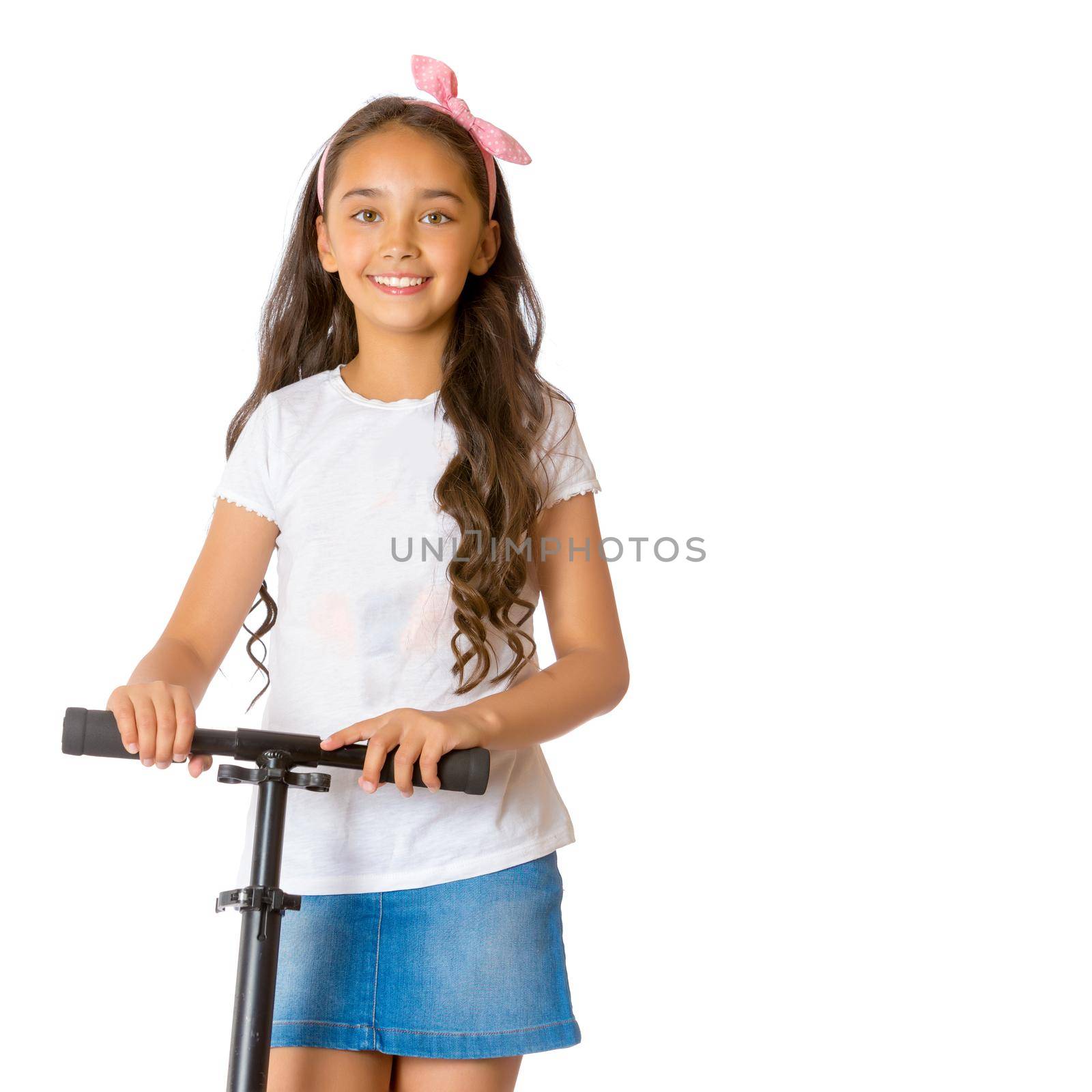 Beautiful teen girl is riding a scooter. The concept of summer vacation, advertising of sports goods. Isolated over white background